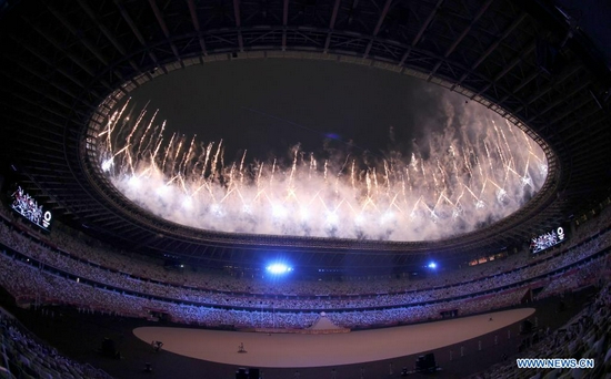 Fireworks explode over the Olympic Stadium during the opening ceremony of the Tokyo 2020 Olympic Games in Tokyo, Japan, July 23, 2021. (Xinhua/Pan Yulong)