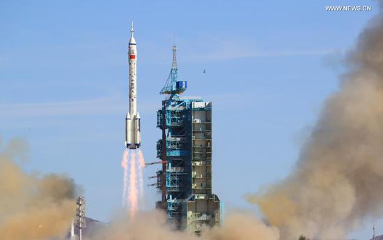 The crewed spacecraft Shenzhou-12, atop a Long March-2F carrier rocket, is launched from the Jiuquan Satellite Launch Center in northwest China's Gobi Desert, June 17, 2021. (Xinhua/Ju Zhenhua)