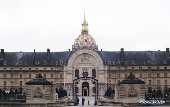 The French national flag flies at half-mast to pay homage to late French President Valery Giscard d'Estaing at the Hotel des Invalides in Paris, France, Dec. 9, 2020. French President Emmanuel Macron on Thursday evening declared Dec. 9 a day of national mourning for late president Valery Giscard d'Estaing. Giscard d'Estaing, president of France from 1974 to 1981, firmly supported European integration and worked with Germany's former chancellor Helmut Schmidt to create the European Monetary System (EMS) in 1979, which later gave birth to the euro, Europe's single common currency. (Xinhua/Gao Jing)
