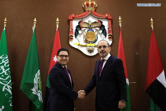 Jordanian Foreign Minister Ayman Safadi (R) shakes hands with Moroccan Foreign Minister Nasser Bourita during a meeting on Jerusalem in Amman, Jordan, on Jan. 6, 2018. King Abdullah II of Jordan on Saturday called for intensified Arab efforts to support the Palestinians following a decision by U.S. President Donald Trump recognizing Jerusalem as the capital of Israel, the state-run Petra news agency reported. In a press conference following a meeting of Arab foreign ministers in Amman, Jordanian Minister of Foreign Affairs Ayman Safadi reiterated the Arabs' rejection of the U.S. decision. (Xinhua/Mohammad Abu Ghosh)