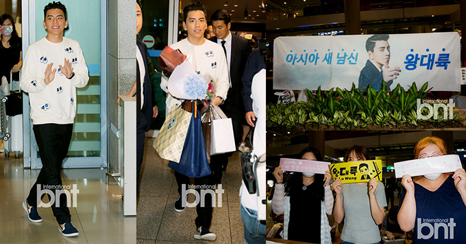 王大陆凌晨抵韩粉丝等候 忙拿礼物露微笑