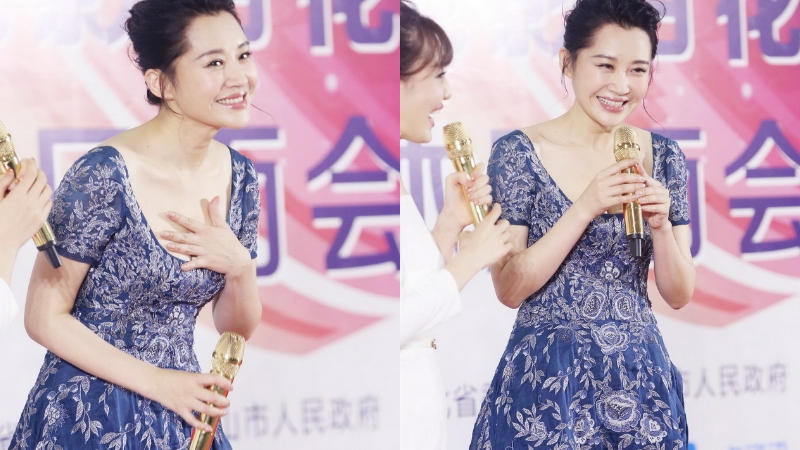 许晴紫裙弯腰抚胸防走光