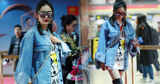 杨幂赴长沙参加金鹰节 长筒靴秀大白腿