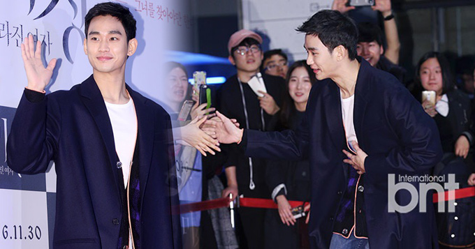 组图:金秀贤黑白装低调亮相 与粉丝握手频鞠躬