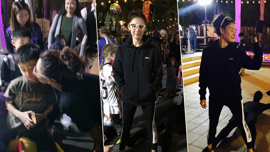 张柏芝玩游戏童心未泯 弯腰亲吻儿子画面温馨