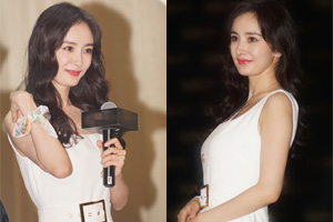 杨幂白裙束纤腰妆容精致 甜笑似洋娃娃
