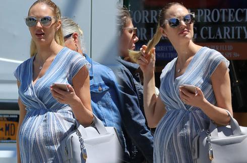 坎蒂丝挺孕肚出街 