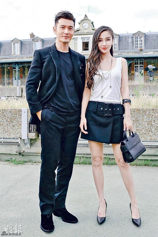 黄晓明与Angelababy夫妻档出席巴黎时装周,吸引大批传媒拍照。