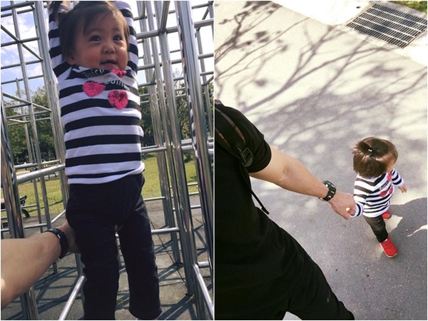 咘咘与爸爸修杰楷趁好天气到公园玩。