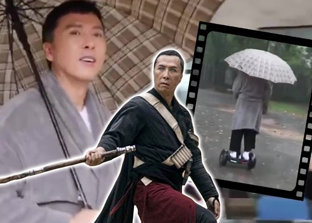 甄子丹在雨中踩着平衡车