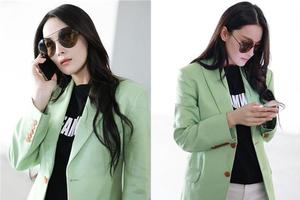 张馨予婚后首现身 清凉秀腿不停打电话