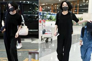 王菲一身黑赶飞机 玩“摸头杀”宠溺又霸道