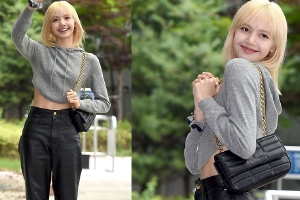 Lisa飞赴巴黎时装周 穿灰色帽衫小露纤腰