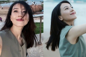 高圆圆晒海边随拍照穿无袖上衣侧颜精致