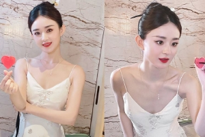 赵丽颖520晒营业照 穿白裙对镜花式比心