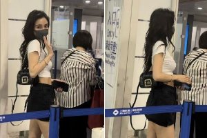 Angelababy出发前往巴黎 露蚂蚁腰大长腿笑容甜