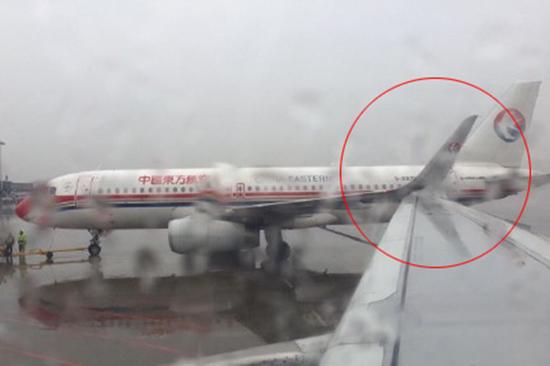 东航两客机在上海虹桥机场停机坪机翼相撞,无