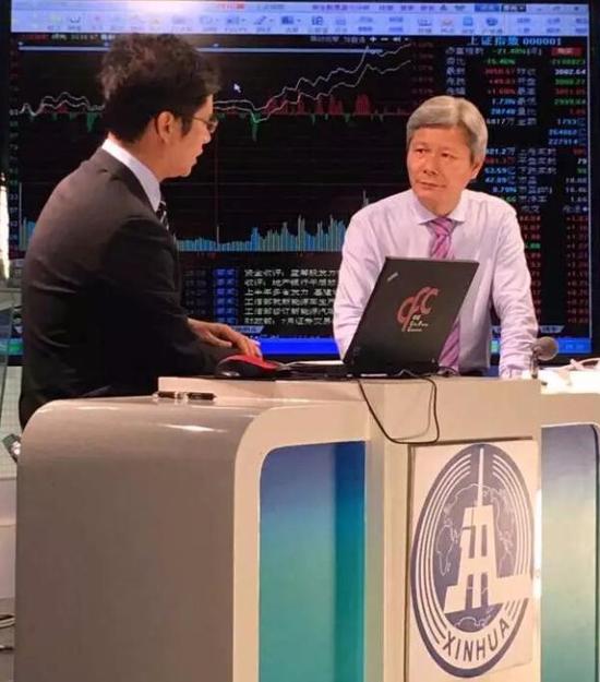 周伯云参加新华社电视访谈。