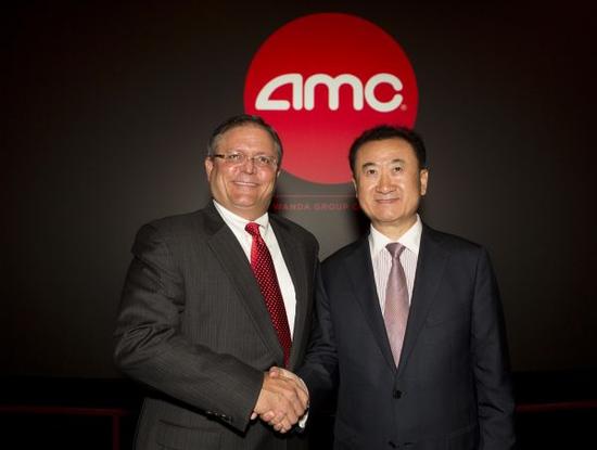 资料图：大连万达宣布完成对美国AMC的并购。新华社发
