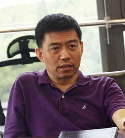 (图为徐明担任投服中心总经理时接受媒体采访时的照片)