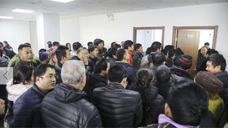 沈阳追回1400万欠款 现场发放给农民工
