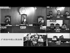 昨日，案件在广州中院一审开庭。图为被告人在被告席上。信息时报记者 陈引 翻拍