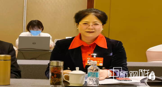 图2为张萍参加会议照。(受访人提供)