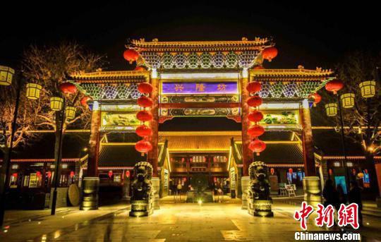 资料图。图为甘肃榆中县兴隆山国际旅游度假区兴隆坊(特色小镇)效果图。 钟欣 摄