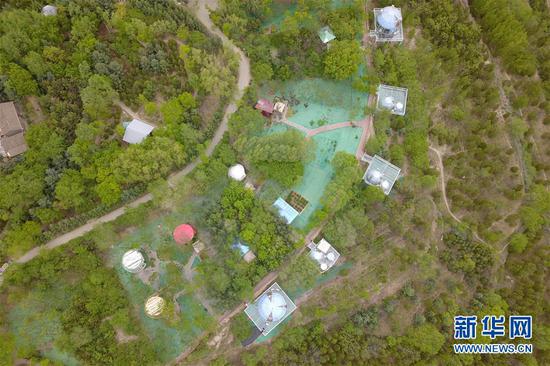 这是5月18日在兰州市城关区拍摄的白塔山公园及周边初夏景象(无人机照片)