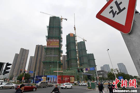 　　資料圖：一處商品房在建中。中新社記者 呂明 攝