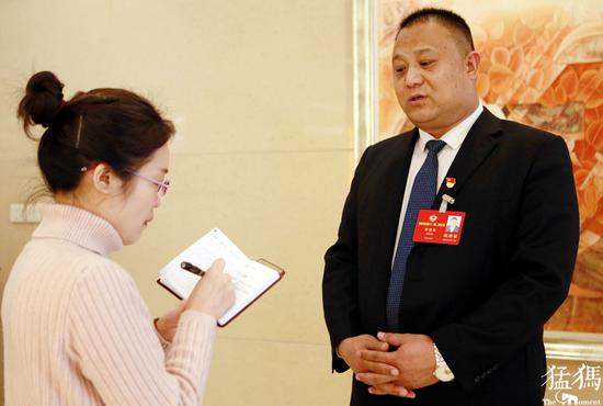 (郭祖良接受记者采访)