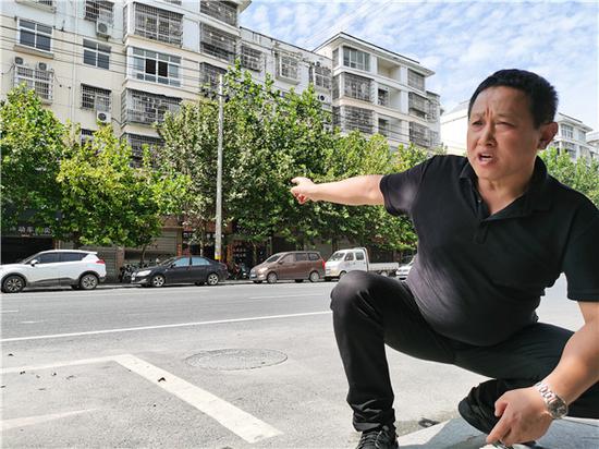 （手指位置就是息县新天地被查封的门面房）