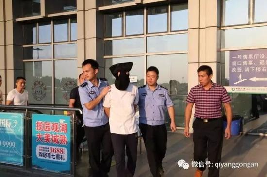 （嫌疑人唐某被押解回祁阳）