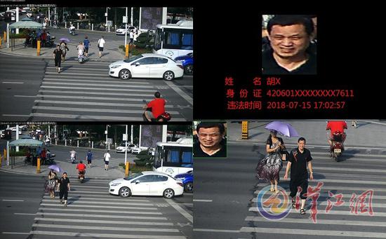 湖北襄阳通过大屏幕公布闯红灯市民的面部特写和身份信息。汉江网 图