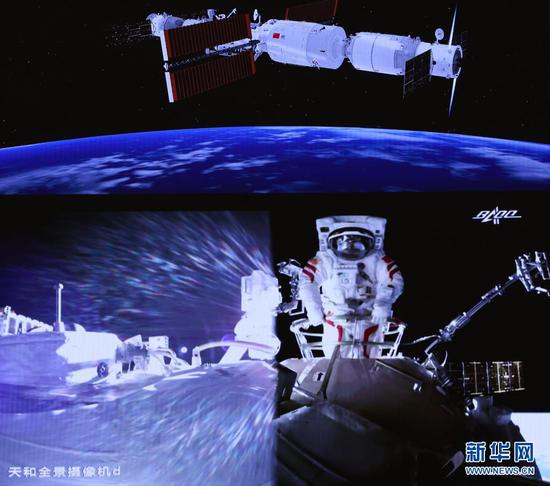 7月4日,在北京航天飞行控制中心大屏拍摄的航天员刘伯明在舱外工作场面。新华社记者 金立旺 摄