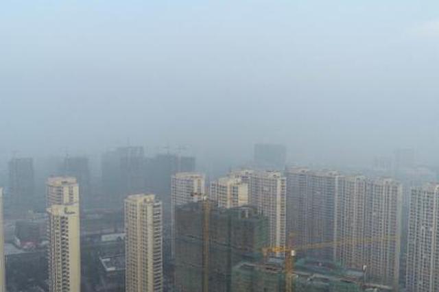 苏皖地区陷入新年首轮霾“伏” 城市地标“隐身”