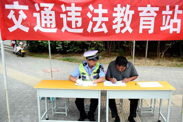 电警抓拍人脸识别一个月 7988起行人、非机动车违法被拍