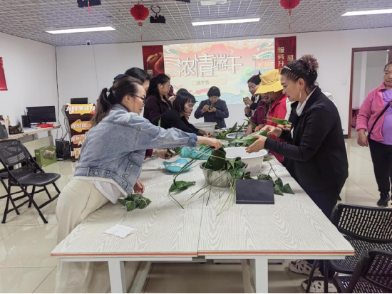 (阳光人寿普洱中支包粽子客户活动)