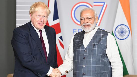 英国首相约翰逊与印度总理莫迪。人民视觉 资料图