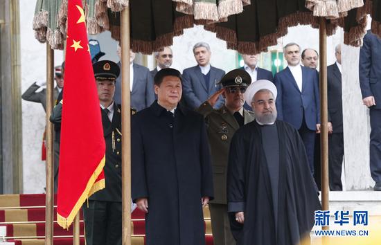 习近平同伊朗总统鲁哈尼举行会谈。