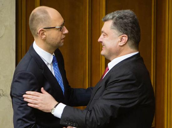 　　资料图：乌克兰总统波罗申科和总理亚采纽克