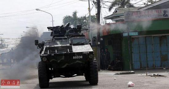 资料图:菲律宾政府军与反政府武装激战。