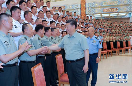 6月14日上午，中共中央总书记、国家主席、中央军委主席习近平在济南亲切接见驻山东部队副师职以上领导干部。新华社记者李刚摄