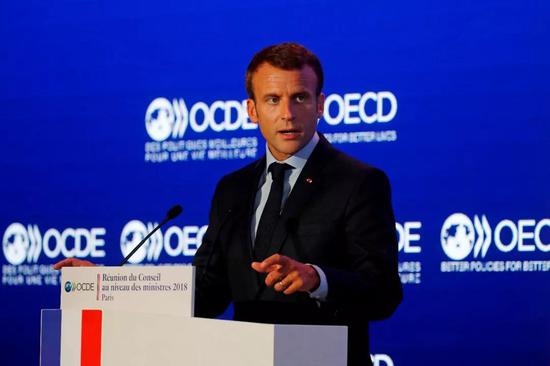 法国总统马克龙在经济合作与发展组织会议上讲话。新华社/法新