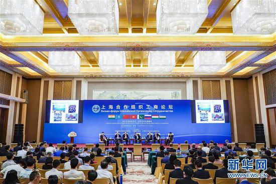 2018年6月6日，约300名来自包括上合组织成员国在内的多国工商界代表在北京出席由中国贸促会主办的上海合作组织工商论坛。新华社记者 沈伯韩 摄