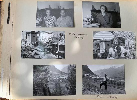 埃莱娜·郎之万-约里奥向记者展示珍藏的家庭相册，里面有钱三强和其父母及全家的合影。新华社记者高静摄
