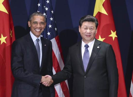 2015年11月30日，中国国家主席习近平在巴黎会见美国总统奥巴马。新华社记者兰红光摄