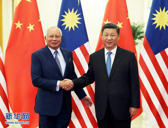 　5月13日，国家主席习近平在北京人民大会堂会见来华出席"一带一路"国际合作高峰论坛的马来西亚总理纳吉布。 新华社记者 马占成摄