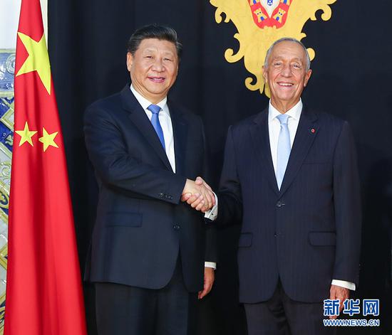 当地时间12月4日,国家主席习近平在里斯本同葡萄牙总统德索萨举行会谈。 新华社记者谢环驰摄