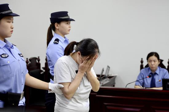 廖某在法庭上受审。新京报记者 郑新洽 摄